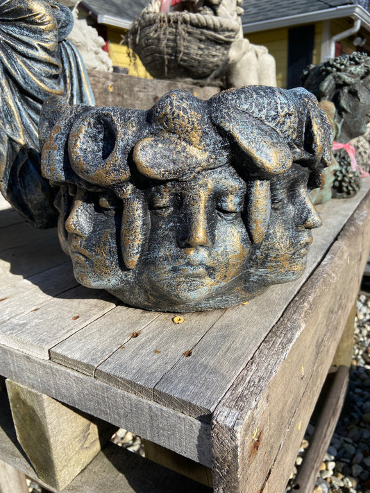Pot with many Faces